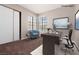 Bright office space with a work station, closet, carpet flooring and natural light from a window at 317 Brent Ct, Henderson, NV 89074