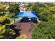 Community park with a playground featuring colorful equipment, ample shade, and a safe, cushioned surface for to enjoy at 317 Brent Ct, Henderson, NV 89074