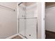 Shower stall with white tile, glass doors, and modern shower head at 317 Brent Ct, Henderson, NV 89074