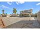 Spacious backyard featuring gravel, a covered patio, and perimeter fencing at 3208 Alcoa Ave, Las Vegas, NV 89102