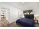 Comfortable bedroom featuring plush carpeting, soft lighting, and ensuite bathroom at 3208 Alcoa Ave, Las Vegas, NV 89102