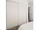 Bedroom with a large closet and white sliding doors, next to the bed at 3208 Alcoa Ave, Las Vegas, NV 89102