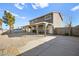 This two-story home features a covered patio, desert landscaping, and neutral paint at 3208 Alcoa Ave, Las Vegas, NV 89102