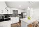 Modern kitchen showcases white cabinetry, quartz counters, and stainless steel appliances at 3208 Alcoa Ave, Las Vegas, NV 89102