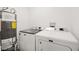 Efficient laundry room with modern washer, dryer, and water heater at 3208 Alcoa Ave, Las Vegas, NV 89102