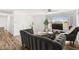 Bright living room featuring hardwood floors, large windows, and modern furnishings at 3208 Alcoa Ave, Las Vegas, NV 89102