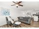Bright open floor plan with hardwood floors and modern furnishings in living area at 3208 Alcoa Ave, Las Vegas, NV 89102