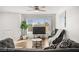 Bright living room with hardwood floors, ceiling fan and comfortable seating at 3208 Alcoa Ave, Las Vegas, NV 89102