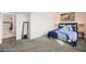 Bedroom featuring plush carpeting, soft lighting, and a full bathroom at 3208 Alcoa Ave, Las Vegas, NV 89102