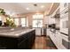 Well-lit kitchen with modern appliances, breakfast bar, and ample cabinet space at 3684 Miguels Ln, Las Vegas, NV 89120