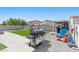 View of backyard with brick pavers, a grill, and play structures at 3871 Trellis View Ave, Las Vegas, NV 89115