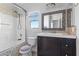 Bathroom featuring shower, vanity with dual sinks, mirror and window at 3871 Trellis View Ave, Las Vegas, NV 89115