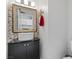 Modern bathroom with a unique sink, decorative mirror, and neutral-colored walls at 3871 Trellis View Ave, Las Vegas, NV 89115