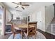 Eat-in kitchen with a round table, hardwood floors, and white kitchen cabinetry at 3871 Trellis View Ave, Las Vegas, NV 89115