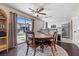 Dining area with hardwood floors and a view to the outside patio and adjacent kitchen at 3871 Trellis View Ave, Las Vegas, NV 89115