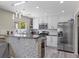 Modern kitchen with white cabinetry, stainless steel appliances, and a functional layout at 3871 Trellis View Ave, Las Vegas, NV 89115