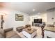 The comfortable living space includes a TV, an office area, and a stylish leather sofa at 4145 Nopal Serrano Ave, Las Vegas, NV 89141