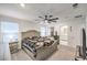 Comfortable main bedroom featuring plush carpet, abundant natural light, and a ceiling fan at 4145 Nopal Serrano Ave, Las Vegas, NV 89141