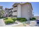 Condominium exterior featuring a well-maintained building, landscaping, and exterior stairs at 4200 S Valley View Blvd # 1120, Las Vegas, NV 89103