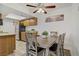 Kitchen and dining area with modern appliances, wood cabinets, and hardwood floors at 4200 S Valley View Blvd # 1120, Las Vegas, NV 89103