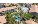 Aerial view of a community pool with palm trees, adjacent to residential buildings at 4200 S Valley View Blvd # 1120, Las Vegas, NV 89103