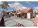Large backyard featuring a covered patio, pool, and desert landscaping at 426 Lost Trail Dr, Henderson, NV 89014