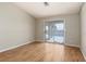 Comfortable bedroom with wood floors and sliding glass doors with a pool view at 426 Lost Trail Dr, Henderson, NV 89014