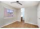 Bedroom with hardwood floors, a window, and an attached bathroom at 426 Lost Trail Dr, Henderson, NV 89014