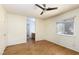 Bedroom with hardwood floors, ceiling fan, and attached bathroom at 426 Lost Trail Dr, Henderson, NV 89014