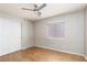 Bedroom with hardwood floors, a ceiling fan, and a sliding door closet at 426 Lost Trail Dr, Henderson, NV 89014