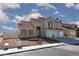 Attractive two-story home with a red tile roof, low maintenance desert landscaping, and a two-car garage at 426 Lost Trail Dr, Henderson, NV 89014