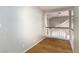 Upstairs hallway with hardwood flooring and a view of the home's chandelier at 426 Lost Trail Dr, Henderson, NV 89014
