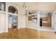 Bright and open living room featuring wood floors and views into the kitchen at 426 Lost Trail Dr, Henderson, NV 89014