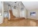 Spacious living room with high ceilings, wood floors, staircase, chandelier, and ample natural light at 426 Lost Trail Dr, Henderson, NV 89014