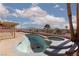 Backyard featuring a pool, jacuzzi, covered patio, and neighborhood views at 426 Lost Trail Dr, Henderson, NV 89014