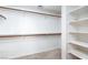 Walk-in closet complete with shelving and rods for clothing storage at 426 Lost Trail Dr, Henderson, NV 89014
