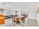 Bright and airy dining room featuring stylish flooring, neutral walls and modern recessed lighting at 465 E Robindale Rd, Las Vegas, NV 89123