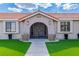 Close up of the courtyard entrance with decorative planters and a secure gated entry at 465 E Robindale Rd, Las Vegas, NV 89123