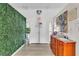 Hallway area with decorative art and wall paneling, leading into the home at 465 E Robindale Rd, Las Vegas, NV 89123