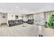 Open living space boasting a full seating arrangement, light flooring, and bright natural light at 465 E Robindale Rd, Las Vegas, NV 89123