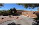 Private backyard features desert landscaping, decorative wall art, and a peaceful outdoor space at 4732 S Adriano Way, Pahrump, NV 89061