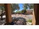 Relaxing backyard with desert landscaping, gravel, cacti, and small trees for privacy at 4732 S Adriano Way, Pahrump, NV 89061