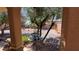 Relaxing backyard showcases a tiered fountain, desert landscaping, trees, and a decorative arrangement at 4732 S Adriano Way, Pahrump, NV 89061