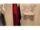 Bathroom featuring multiple towels and metal artwork with decorative gowns hanging in the background at 4732 S Adriano Way, Pahrump, NV 89061