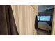 Bright bathroom with a shower and tub combination next to a bedroom with a ceiling fan and carpeted floors at 4732 S Adriano Way, Pahrump, NV 89061