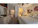 Bedroom features a large bed, dresser, and a view into an en-suite bathroom at 4732 S Adriano Way, Pahrump, NV 89061
