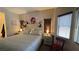 Bright bedroom with a ceiling fan, two windows, and neutral wall colors at 4732 S Adriano Way, Pahrump, NV 89061