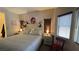 Well-lit bedroom featuring windows, cozy furnishings, and a ceiling fan at 4732 S Adriano Way, Pahrump, NV 89061