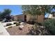 Charming single-story home with stone accents, desert landscaping, and a two-car garage at 4732 S Adriano Way, Pahrump, NV 89061