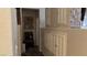 Hallway with built-in cabinets, shoe storage, and stylish wall decor at 4732 S Adriano Way, Pahrump, NV 89061